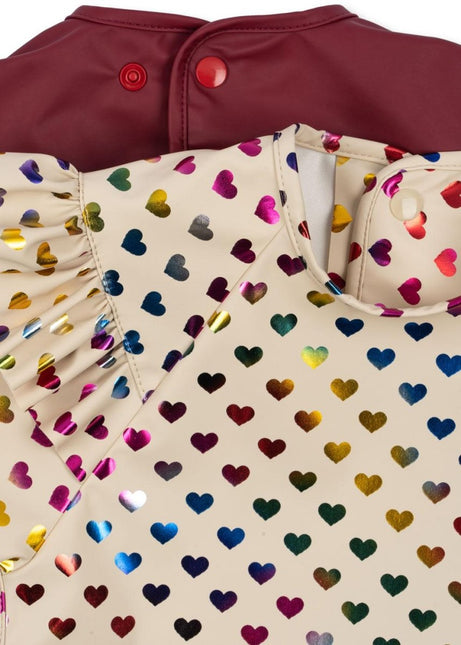 Konges Slojd Slabbetje Met Mouwen Coeur Glitter/ Sangria 2St koop je bij Babywinkel